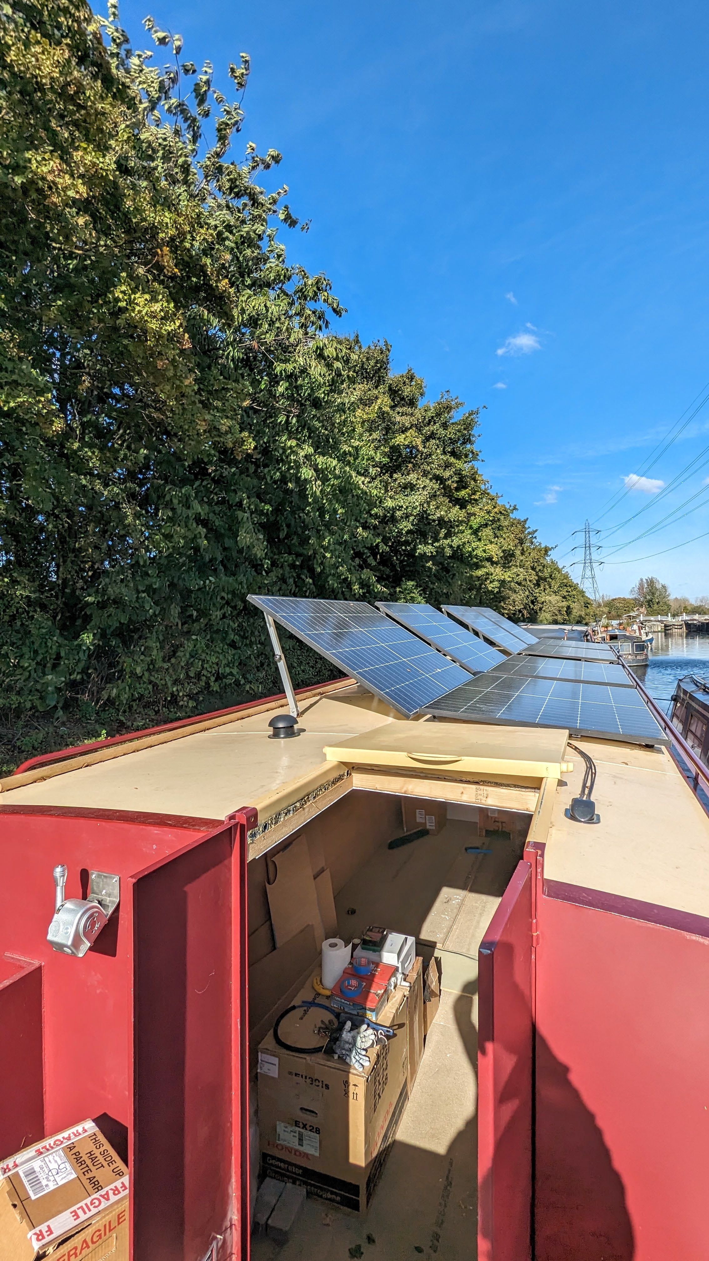 Narrowboat with solar panels on canal